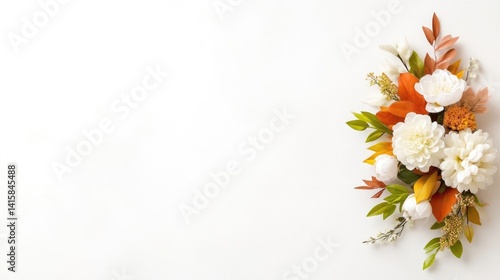 Autumnal floral arrangement on white background.  Delicate bouquet of white and orange flowers, leaves, and greenery.  Perfect for fall decor