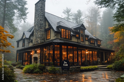 Cozy Lodge Surrounded by Foggy Forest During Autumn Afternoon for Peaceful Re...