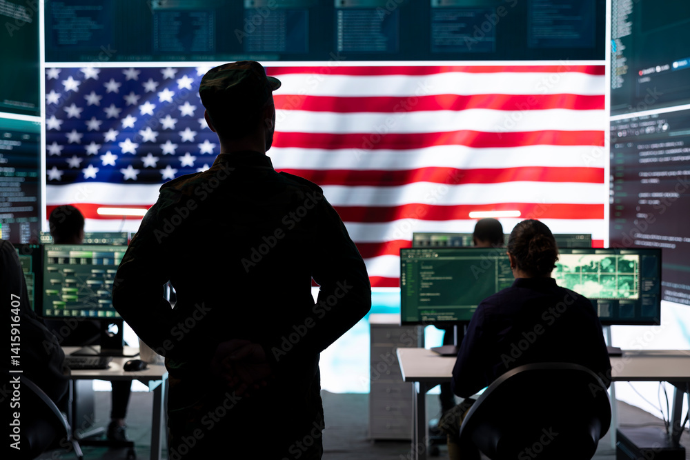 American military personnel ensuring servers protection and classified information, protecting state secrets in high tech agency office. Army soldier supervises hacking activity.