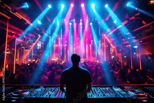 A DJ performs at a vibrant nightclub, bathed in colorful lights, to a large, energetic crowd.