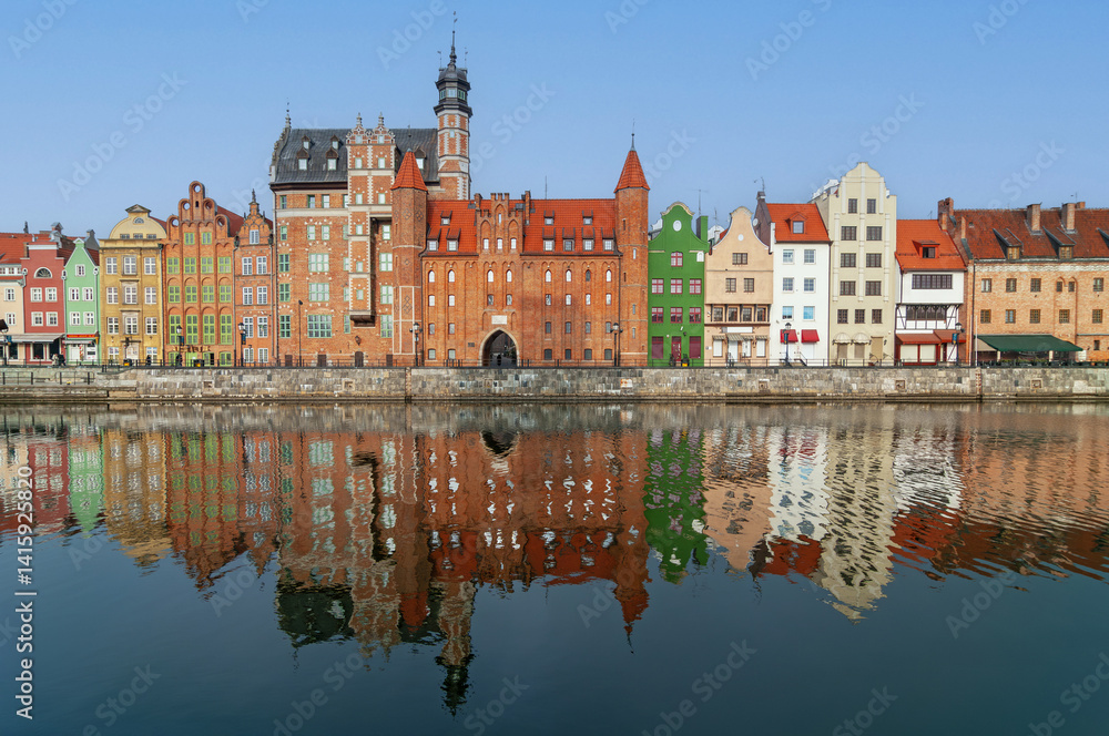 Fototapeta premium Colourful historic houses near Motlawa river in port of Gdansk, Poland.