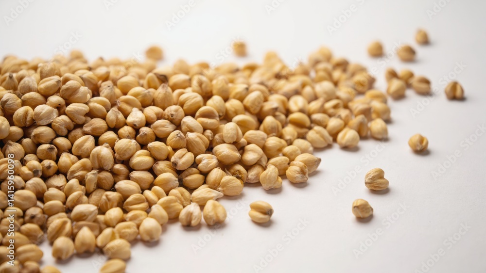 Pile of beige corn kernels ready for processing or consumption. Pile of beige corn kernels ready for processing or consumption.