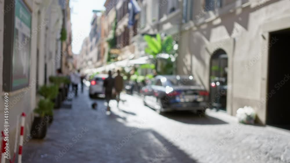 Defocused scene of people walking on a cobblestone street in rome, italy, with blurred cars and historic buildings creating a bokeh effect in the old town urban setting. Defocused scene of people walking on a cobblestone street in rome, italy, with blurred cars and historic buildings creating a bokeh effect in the old town urban setting.