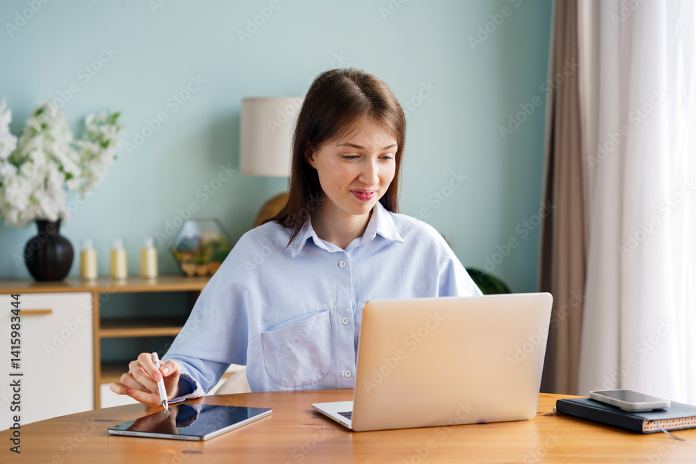 Focused Professional Engages in Digital Tasks at a Cozy Workspace Surrounded by Greenery Focused Professional Engages in Digital Tasks at a Cozy Workspace Surrounded by Greenery