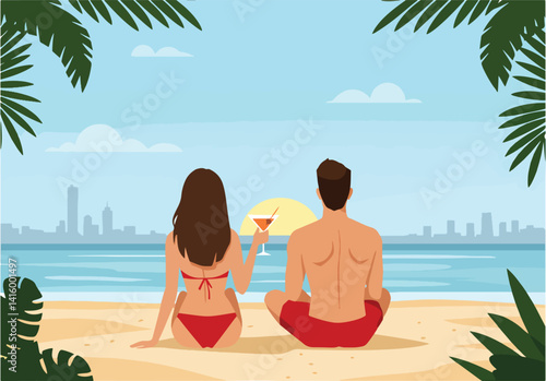 Back view of a man and woman relaxing on the sand with drinks, overlooking the ocean and a distant cityscape. Tropical vacation and leisure