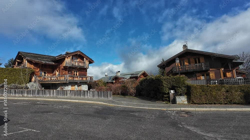 Charming street of Le Praz, Courchevel, France, lined with traditional wooden chalets Charming street of Le Praz, Courchevel, France, lined with traditional wooden chalets