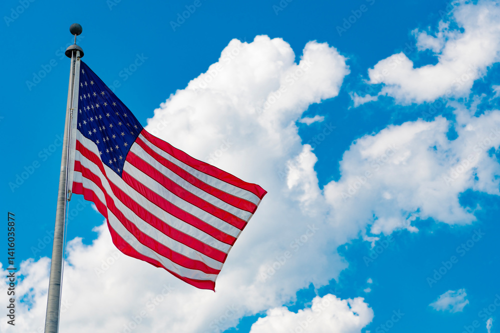 Naklejka premium Independence day. Patriotic symbol. American Flag for Memorial Day or 4th of July. American flag waving, labor day. Flag of the USA. National waving flag of united states on blue sky
