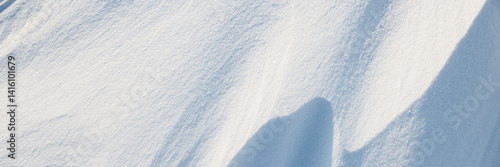 Obraz na płótnie Snow texture. Wind sculpted patterns on snow surface. Wind in the tundra and in the mountains on the surface of the snow sculpts patterns and ridges. Arctic, Polar region. Winter panoramic background. w salonie