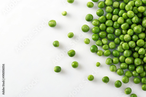 Green peas are scattered on the white background on the right