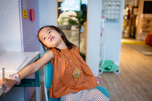 Adorable kids girl enjoy toy in kid room cozy house