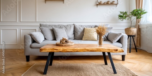 Cozy living room with a natural wooden coffee table and gray sofa
