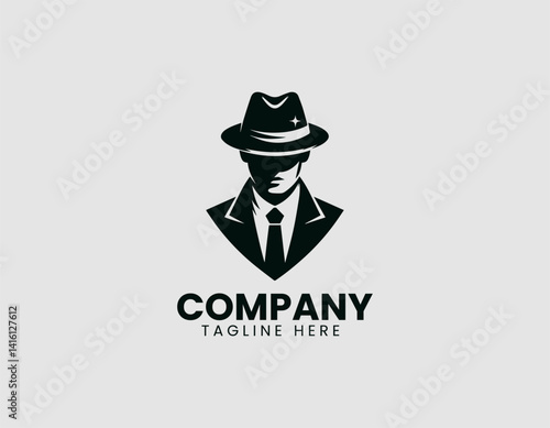 Mystery Silhouette: A shadowy silhouette of a man in a fedora hat, embodying intrigue and secrecy, is elegantly presented with a modern design.