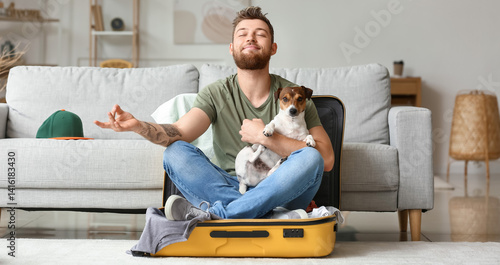 Young man with cute dog med...
