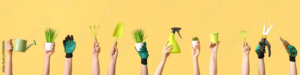 Female hands with gardening tools and plants on yellow background