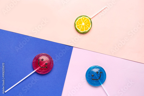 Sweet lollipops on colorful...
