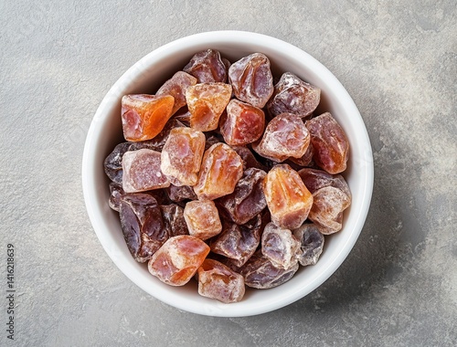 Ripe dates in a white bowl on a grey background, close-up view. Ramadan food concept with copy space for text or design. Fresh date fruits. Stock photo contest winner, high resolution, high detail, na