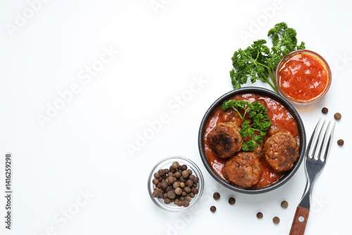 Obraz na płótnie Meatballs in a bowl with spices and sauce on a light background w salonie