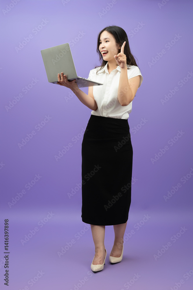 Asian girl is posing in front of a background Asian girl is posing in front of a background