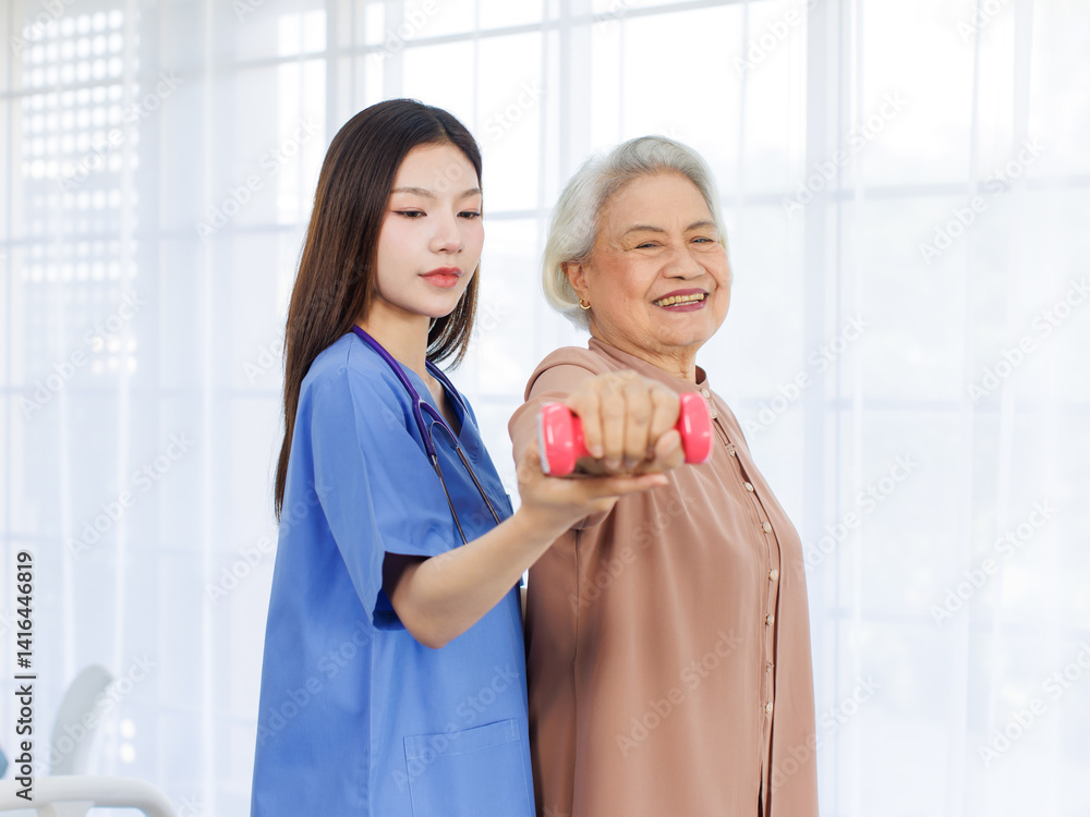 Asian young nurse physiotherapist help old woman to exercises with lightweight dumbbell in hospital, rehabilitation strengthen muscles supporting patient care physical therapy center healthy wellness.