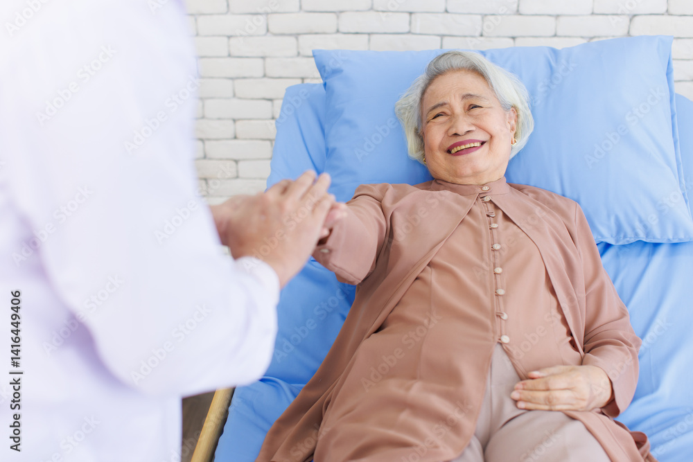 Obraz premium Asian senior woman lay on bed with doctor closeup holding hands with empathy care to trust support or help at hospital, Healthcare elderly patient and medical professional consultation wellness being.