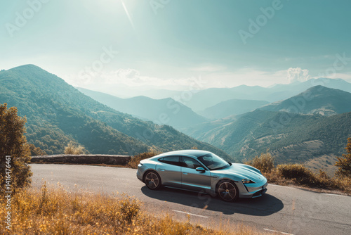 Electric luxury car driving on a scenic mountain road. E-mobility, sustainable travel.