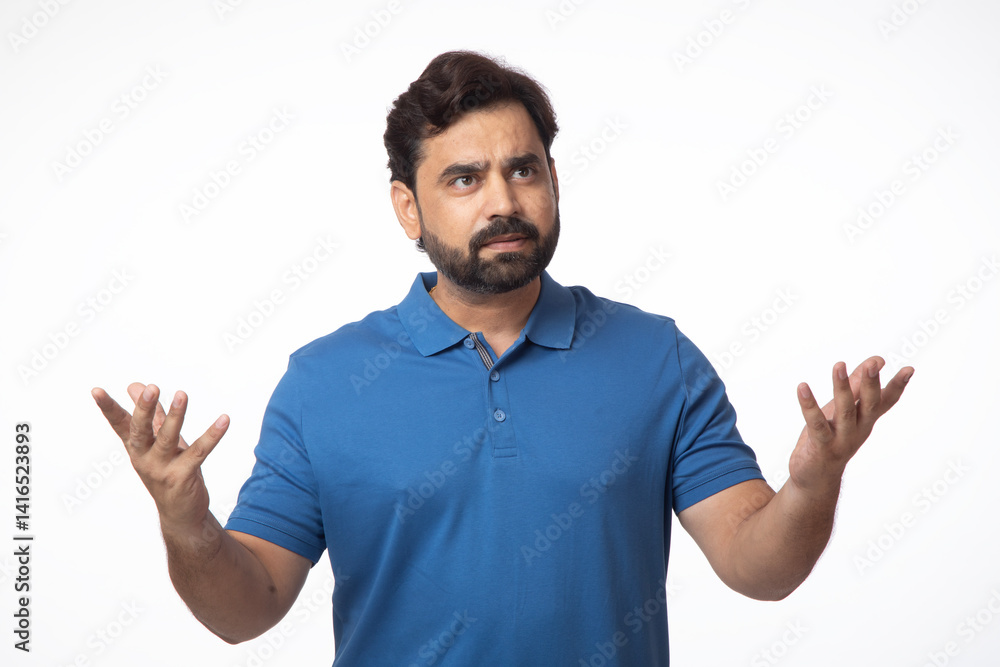 Surprised, shocking, deep thought and confused Indian man gesturing some hands side moments against white background Surprised, shocking, deep thought and confused Indian man gesturing some hands side moments against white background