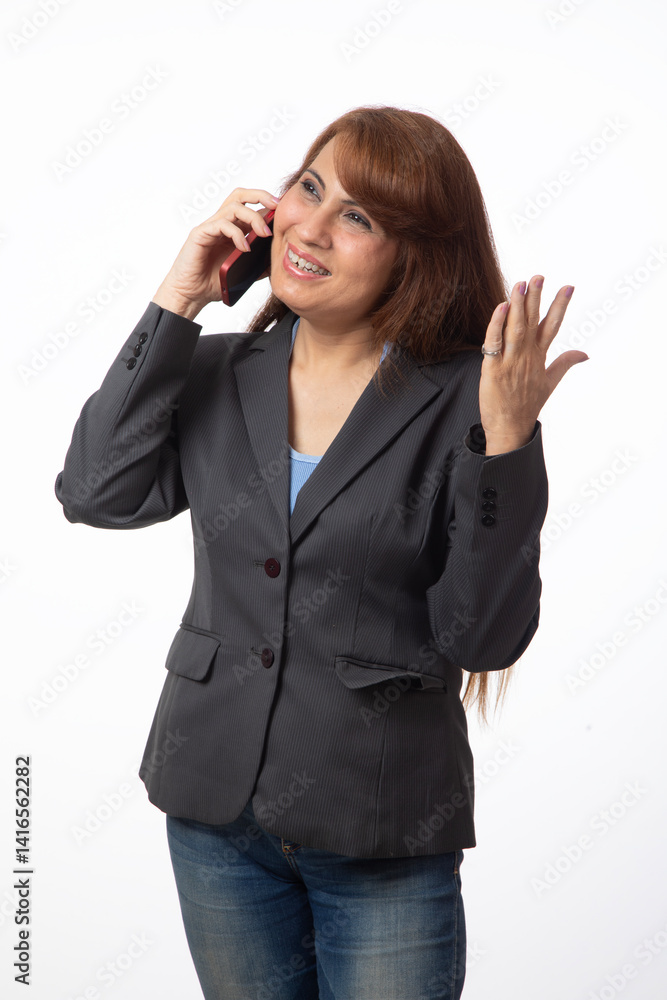Indian business or corporate woman using mobile phone against white background Indian business or corporate woman using mobile phone against white background