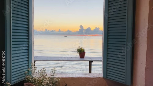 Looking at sunrise sea view through opening window. Bedroom interior of resort  on the summer beach.