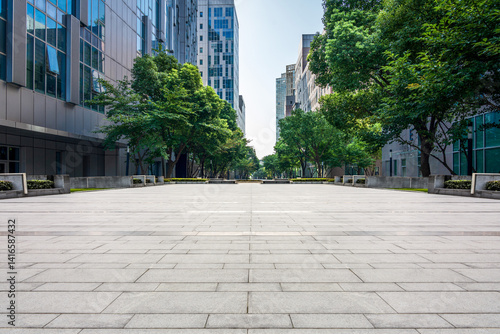 Принти на полотні Serene Urban Pathway Surrounded by Modern Architecture and Lush Greenery