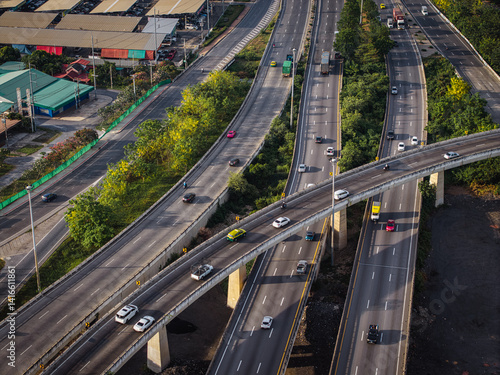 Obraz na płótnie Aerial view intersection transport cross road building with traffic vehicle w salonie