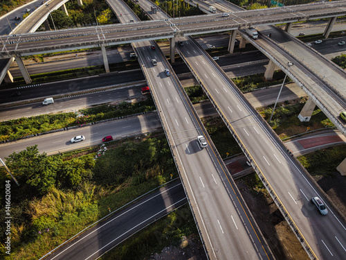 Obraz na płótnie Aerial view intersection transport cross road building with traffic vehicle w salonie