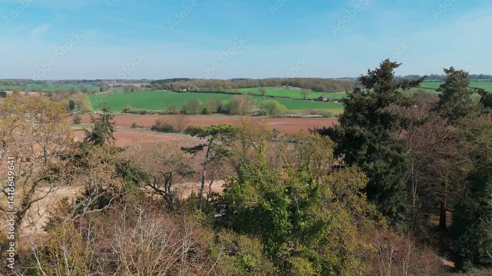Lush greenery and scenic rolling hills captured from a drone over Nowton Park, Bury St. Edmunds Lush greenery and scenic rolling hills captured from a drone over Nowton Park, Bury St. Edmunds