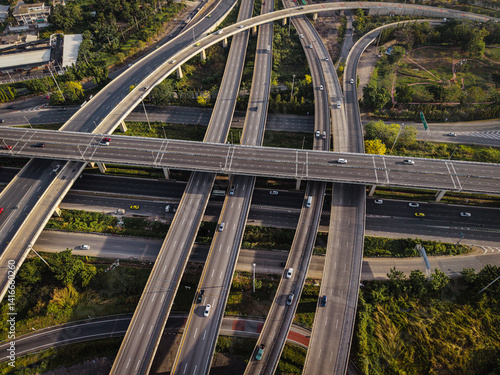 Obraz na płótnie Aerial view intersection transport cross road building with traffic vehicle w salonie