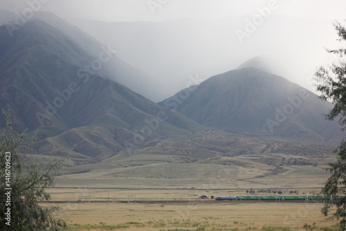 plain. mountains, fog. fog settles from the mountains into the valley before the weather changes