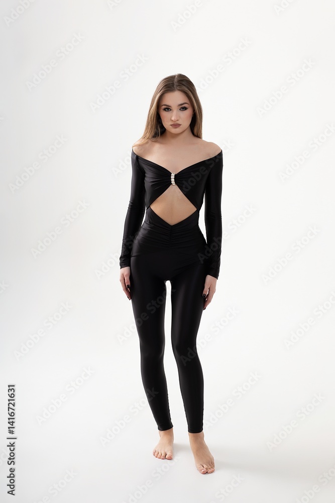 girl in black overalls and heels on white background girl in black overalls and heels on white background