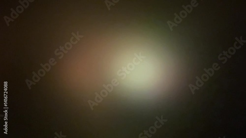 Colorful light leaks on footage, on black background. Studio lens flare burst. Natural lamp light bokeh effect. For creating overlays on footage. Video styling. Scene transitions.