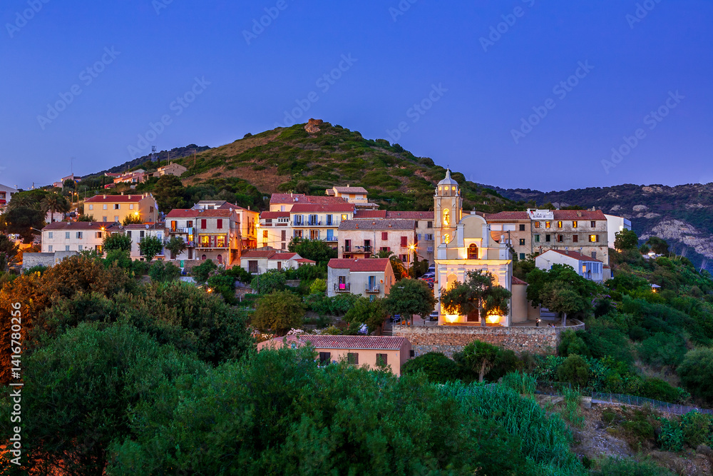 Latin church at sunset, Cargèse, Corsica, France. Typical and picturesque hillside village. Hilltop town nestled on the coast above the Mediterranean sea. Latin church at sunset, Cargèse, Corsica, France. Typical and picturesque hillside village. Hilltop town nestled on the coast above the Mediterranean sea.