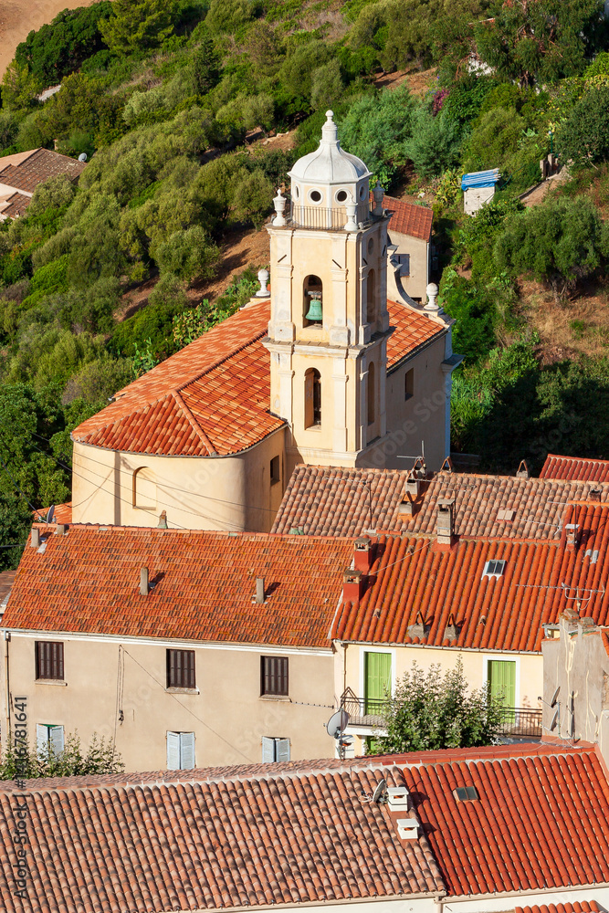 Fototapeta premium Latin church, in Cargèse, Corsica, France. Typical and picturesque hillside village. Hilltop town nestled on the coast above the Mediterranean sea.