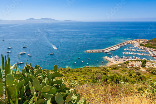 Fotografie The harbour of Cargèse, Corsica, France, typical and picturesque hillside village