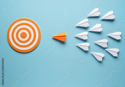 Paper airplanes targeting a goal, symbolizing leadership and strategic direction with a unified approach.