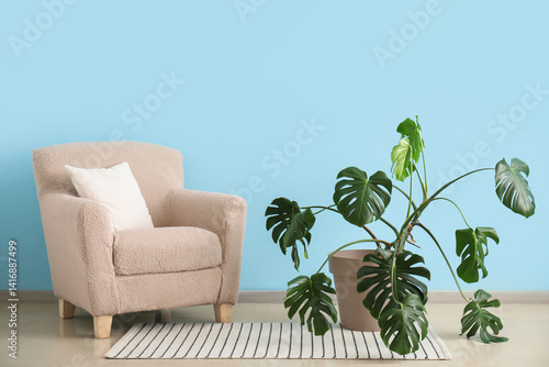Cozy beige armchair with a ...