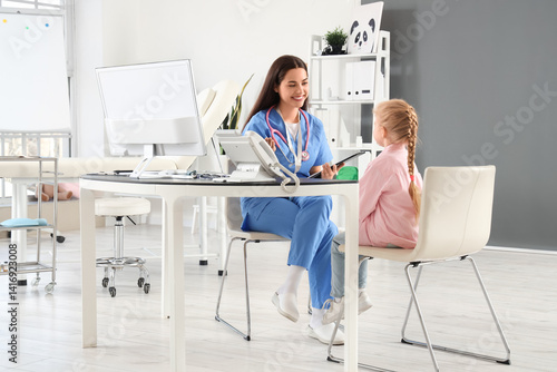 Female pediatrician working...