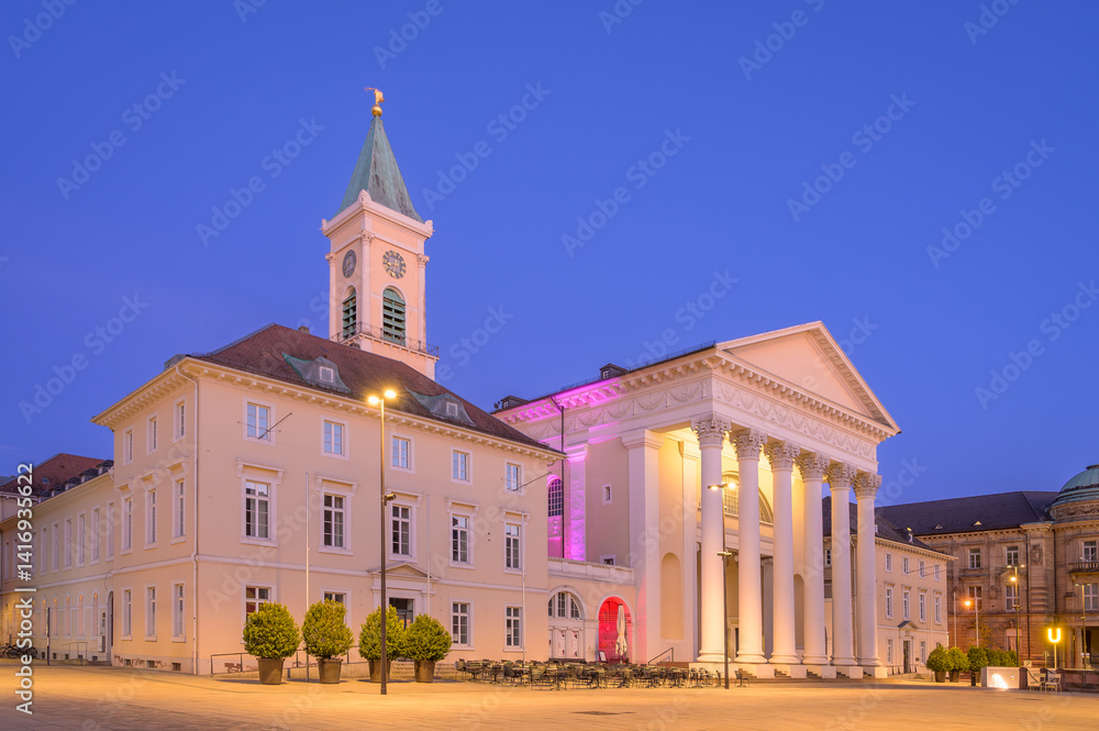 Bright evening at market square featuring the so called Stadtkirche - or City Church, in Karlsruhe with illuminated architecture