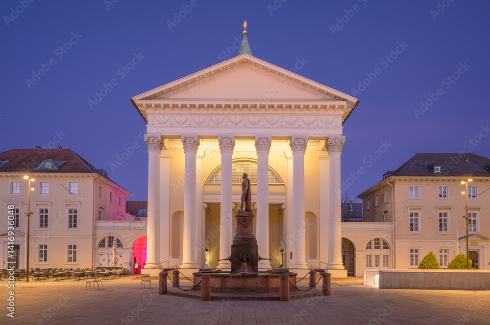 Bright evening at market square featuring the so called Stadtkirche - or City Church, in Karlsruhe with illuminated architecture