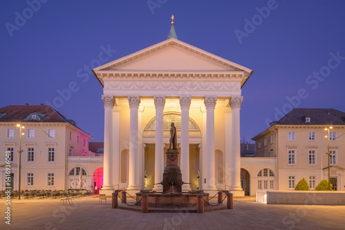 Obraz na płótnie Bright evening at market square featuring the so called Stadtkirche - or City Church, in Karlsruhe with illuminated architecture w salonie