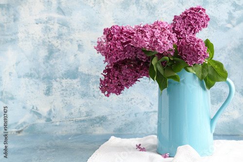 Jug with blooming lilac flo...