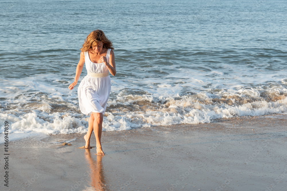 Running with the tide: woman escaping the wave Running with the tide: woman escaping the wave
