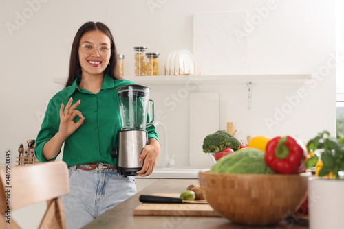 Young Asian woman with blen...