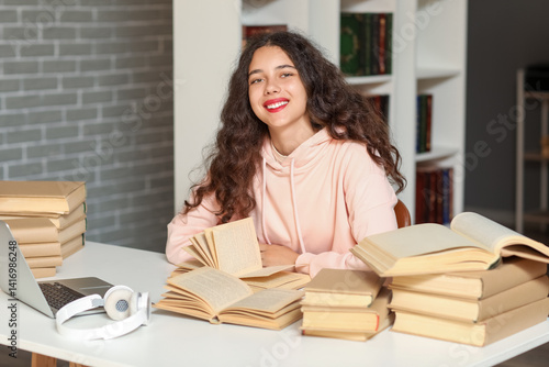 Female student studying wit...