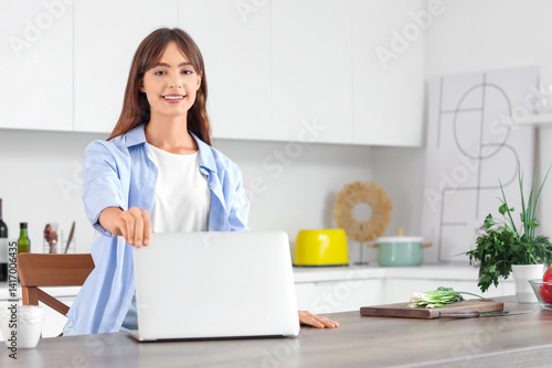 Smiling young woman working...